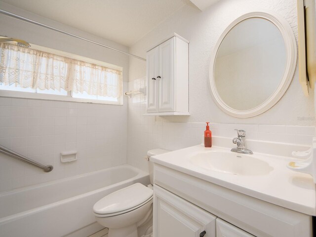 full bathroom featuring shower / tub combination, toilet, and vanity