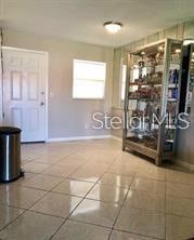 interior space with tile patterned floors