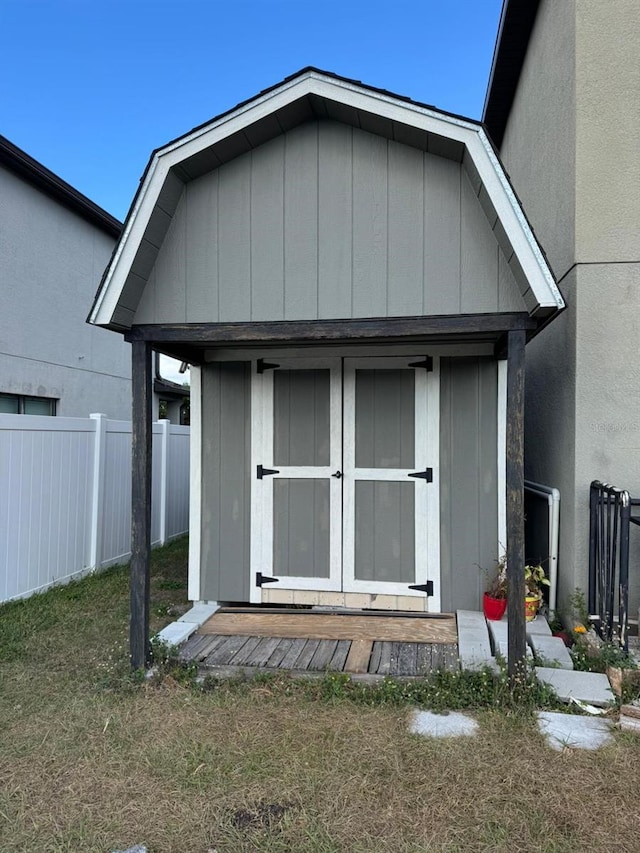 view of outbuilding with a yard