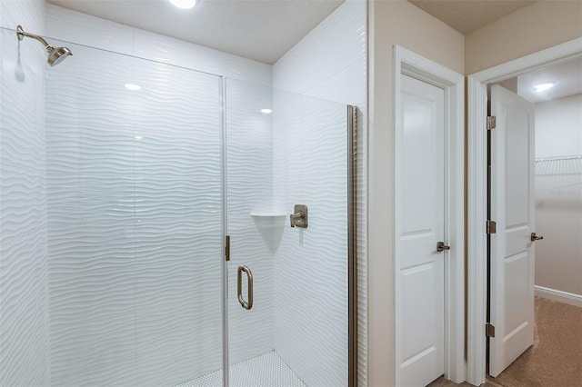 full bath featuring a shower stall