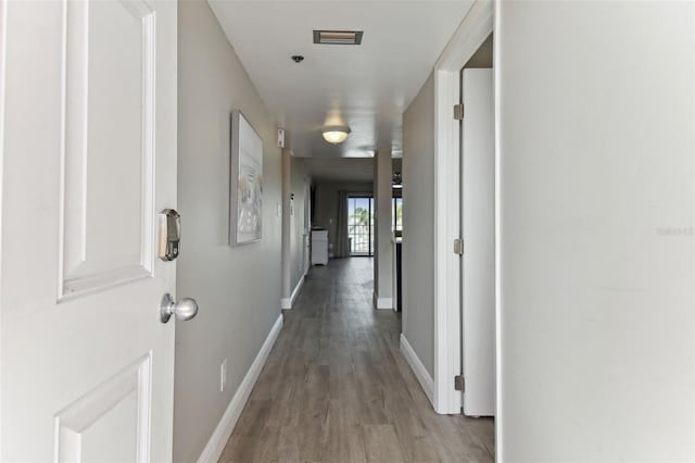 corridor featuring light hardwood / wood-style flooring