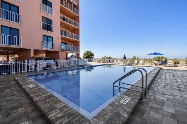 view of pool featuring a patio area