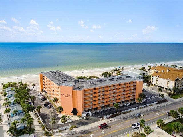 bird's eye view with a water view and a beach view