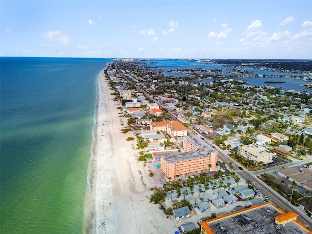 drone / aerial view featuring a water view and a view of the beach