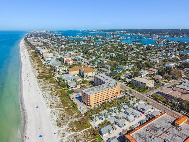 bird's eye view with a water view and a beach view