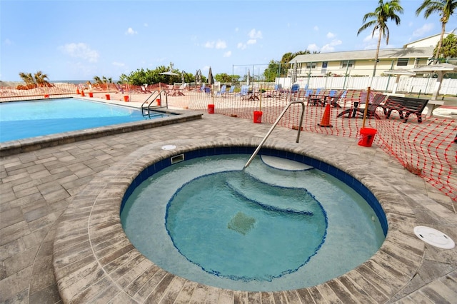 view of pool featuring a community hot tub