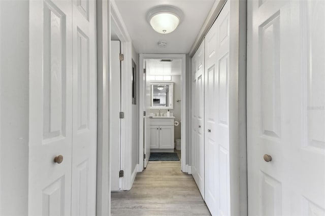 hallway featuring light hardwood / wood-style flooring