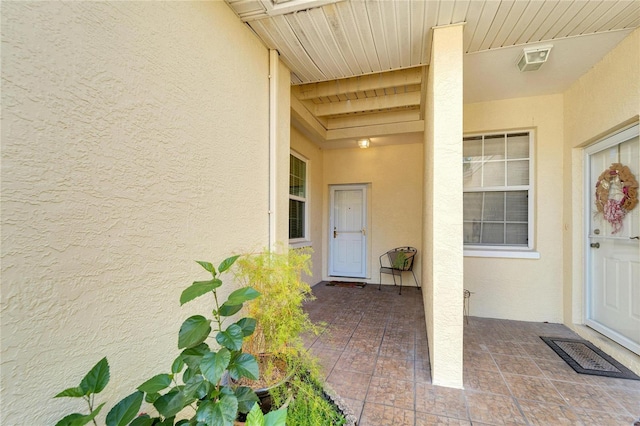 entrance to property with a patio area