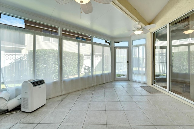 unfurnished sunroom with a wealth of natural light and ceiling fan