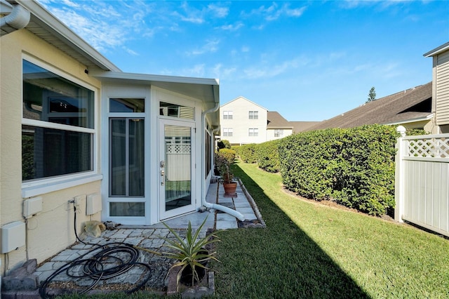 view of yard with a sunroom