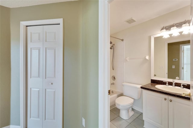 full bathroom featuring tile patterned flooring, vanity, toilet, and shower / tub combination