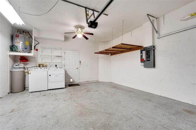 garage featuring ceiling fan, water heater, electric panel, and washing machine and clothes dryer