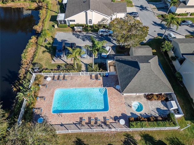 birds eye view of property featuring a water view