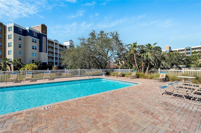 view of swimming pool with a patio