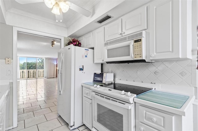 2650 Pearce Dr Unit 403, Clearwater, FL 33764 - kitchen with white appliances, crown molding, a ceiling fan, light countertops, and white cabinetry