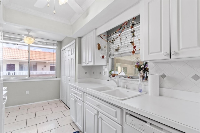 2650 Pearce Dr Unit 403, Clearwater, FL 33764 - kitchen with ceiling fan, ornamental molding, white dishwasher, white cabinetry, and a sink