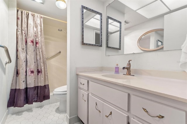 2650 Pearce Dr Unit 403, Clearwater, FL 33764 - bathroom with toilet, vanity, tile patterned floors, and a shower with shower curtain