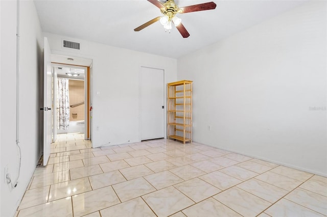 spare room featuring ceiling fan