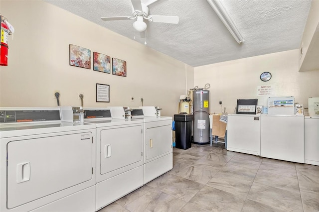 2650 Pearce Dr Unit 403, Clearwater, FL 33764 - shared laundry room featuring washer and clothes dryer, a ceiling fan, a textured ceiling, light marble finish flooring, and water heater