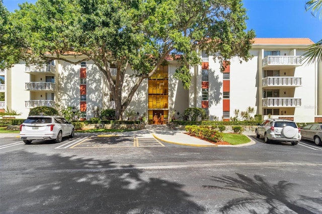 2650 Pearce Dr Unit 403, Clearwater, FL 33764 - view of apartment building / complex featuring uncovered parking
