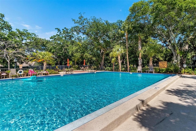 pool featuring fence