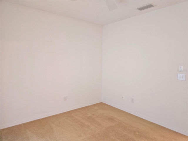 spare room with light colored carpet