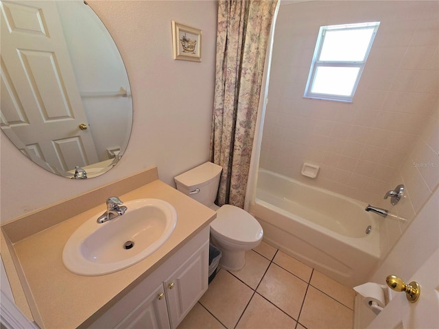 full bathroom featuring tile patterned flooring, vanity, toilet, and shower / bath combo with shower curtain