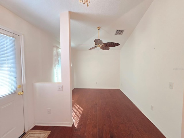 interior space with ceiling fan and dark hardwood / wood-style flooring