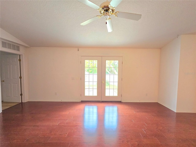 spare room with a textured ceiling, french doors, ceiling fan, and dark hardwood / wood-style flooring