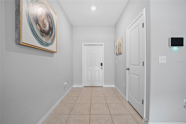 hallway with light tile patterned floors