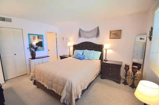 carpeted bedroom featuring a closet