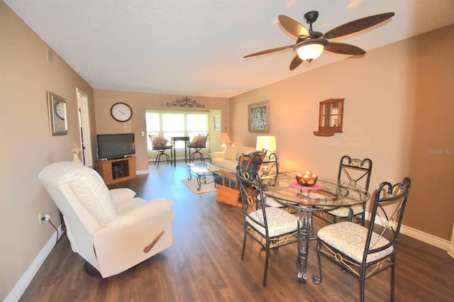 dining area featuring ceiling fan and dark wood-type flooring