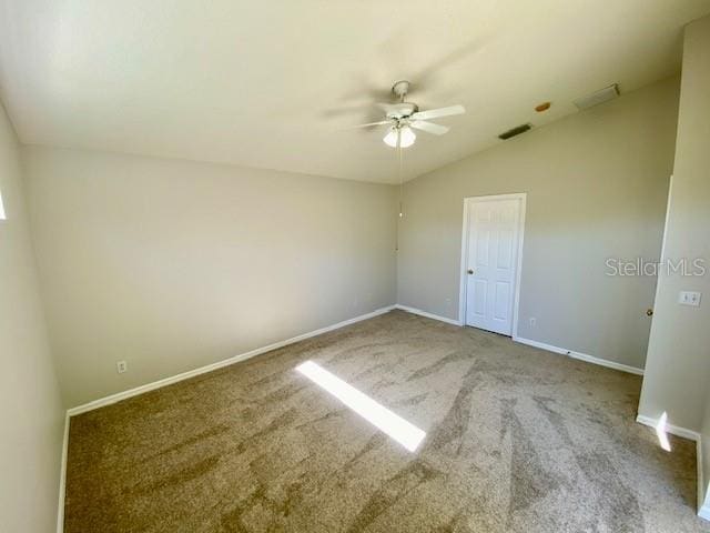 unfurnished room featuring carpet, ceiling fan, and lofted ceiling