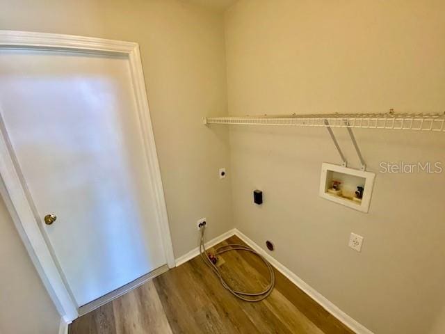 laundry area with washer hookup, wood-type flooring, and hookup for an electric dryer