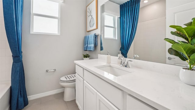 full bathroom featuring tile patterned floors, vanity, a healthy amount of sunlight, and toilet