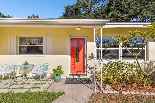 entrance to property with a porch