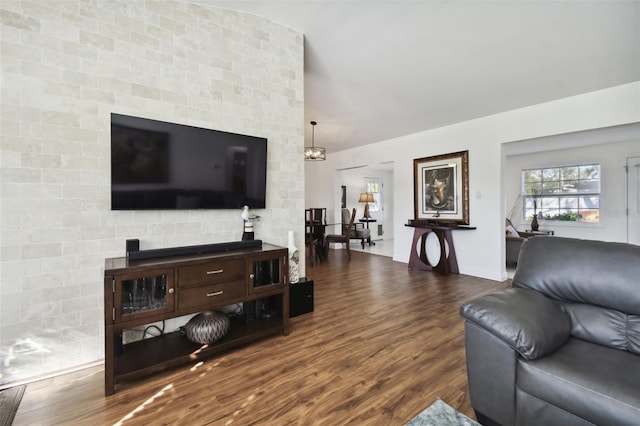 living room featuring dark hardwood / wood-style flooring and a chandelier