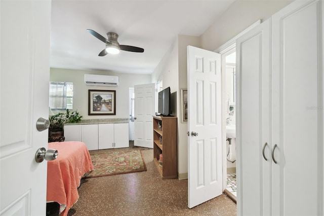 bedroom with a wall mounted air conditioner and ceiling fan