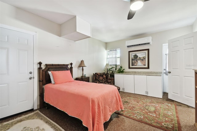 bedroom featuring a wall mounted air conditioner, dark carpet, and ceiling fan