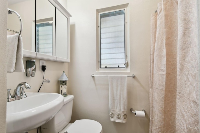 bathroom with sink and toilet