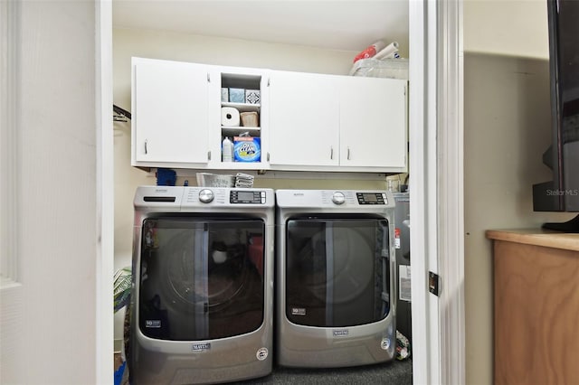 laundry room featuring cabinets and independent washer and dryer