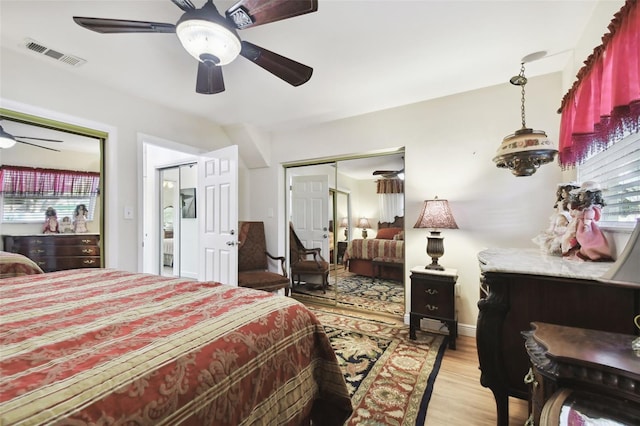 bedroom featuring light hardwood / wood-style flooring and ceiling fan