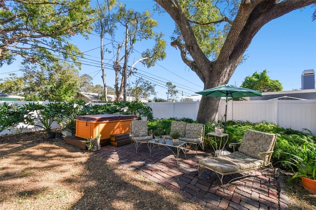 view of patio with a hot tub