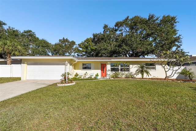 ranch-style house with a garage and a front lawn