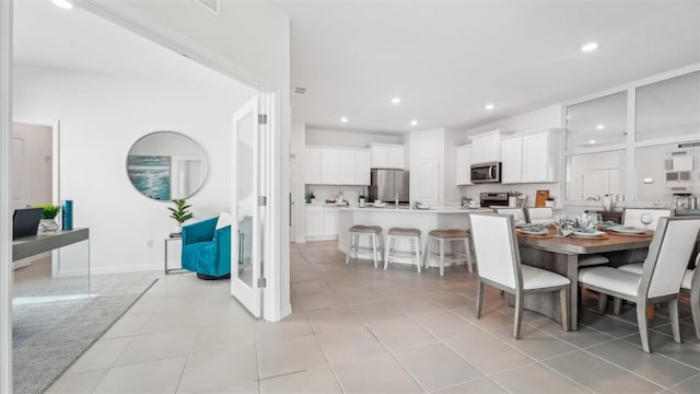 dining space with light tile patterned floors