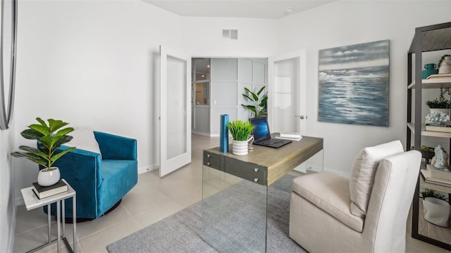 office area with french doors and light tile patterned floors