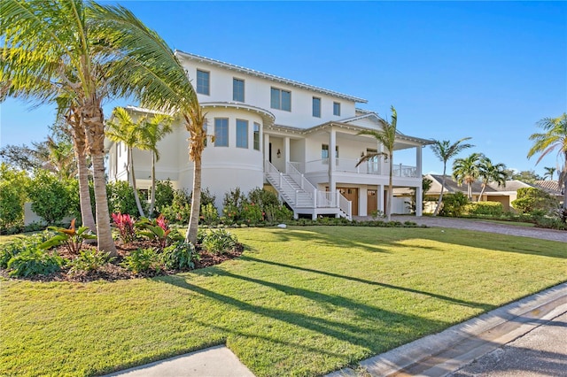 view of front of house with a front lawn and covered porch