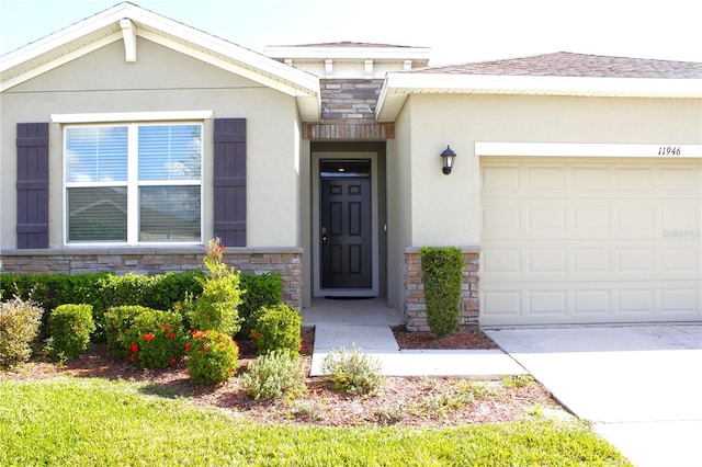 doorway to property with a garage