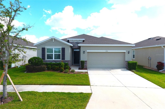 view of front facade featuring a garage and a front lawn