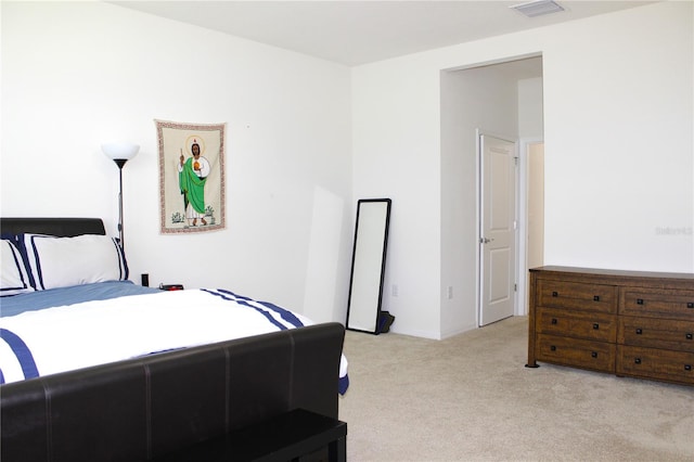 bedroom with light colored carpet